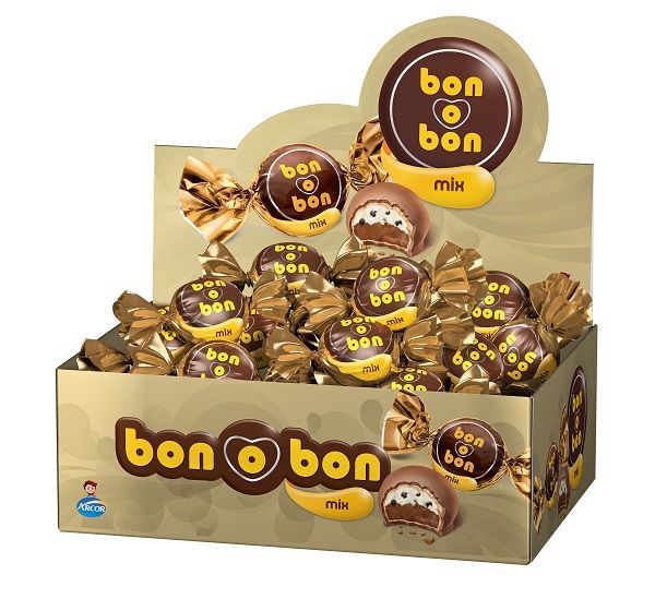 Front of zip tote bag with white canvas, black canvas straps and handle, and black zipper pulls.